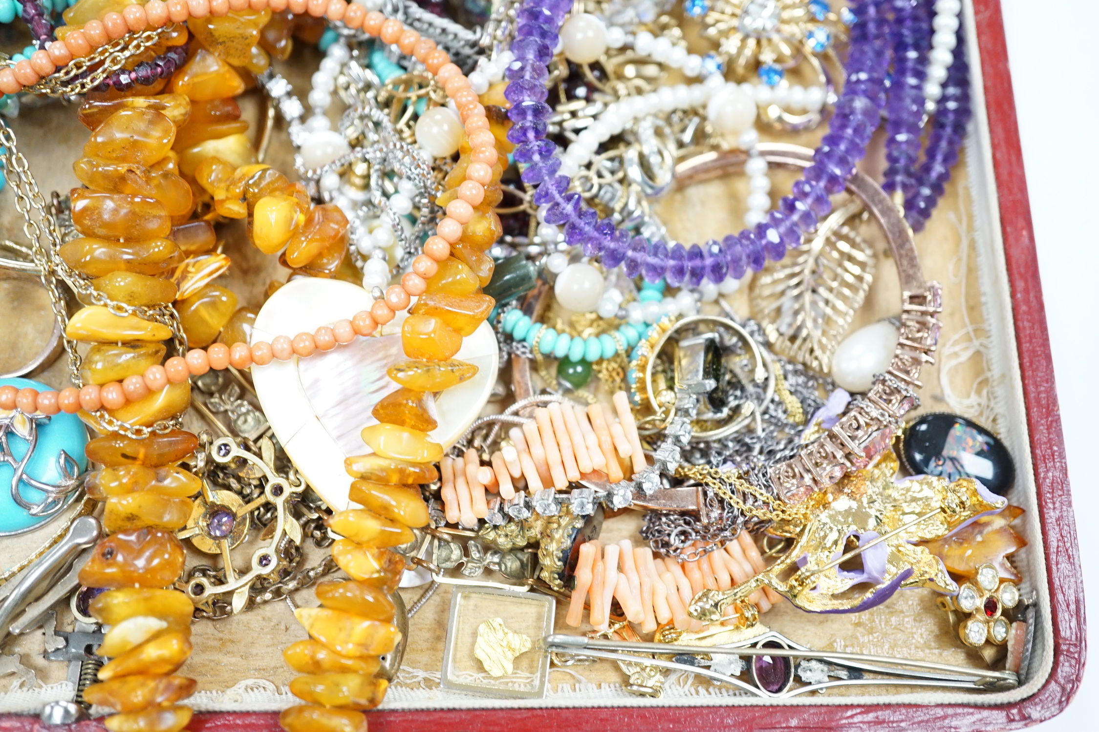 Assorted costume jewellery including amber necklace, coral necklace, cameo shell bracelet etc.